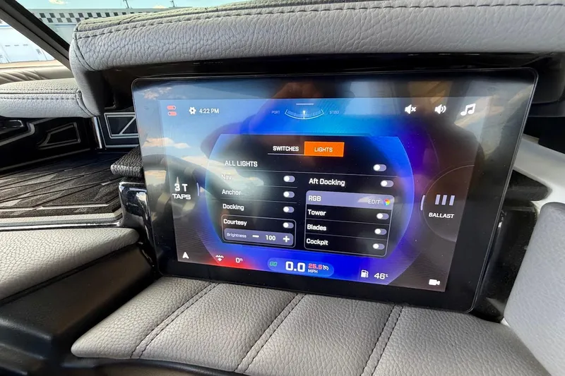 Slide: The Image of Touchscreen control panel in 2025 Tigé Ultré 25ZX boat, displaying lighting and ballast settings. - 34