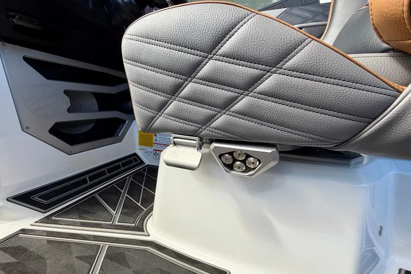 Slide: The Image of Interior of 2025 Tigé Ultré 25ZX boat with quilted seat and sleek design. - 40