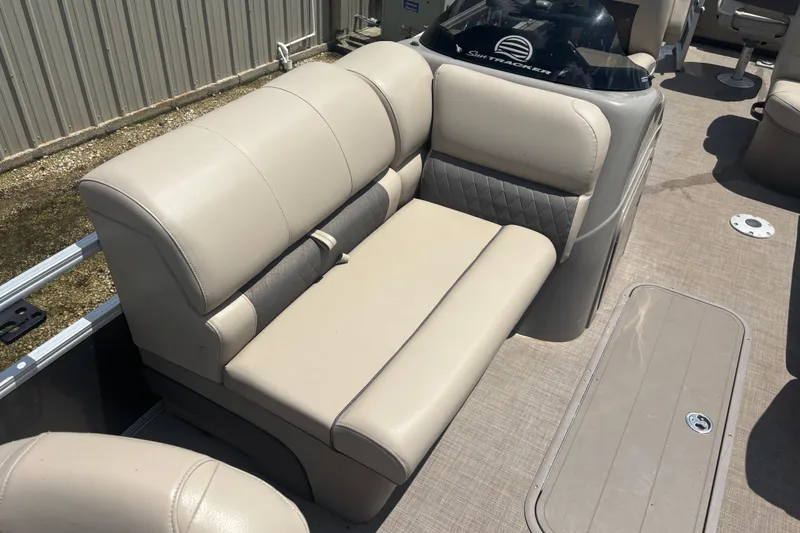 Slide: The Image of 2020 Sun Tracker Fishin' Barge 22 XP3 interior seating, beige upholstery, spacious layout. - 7