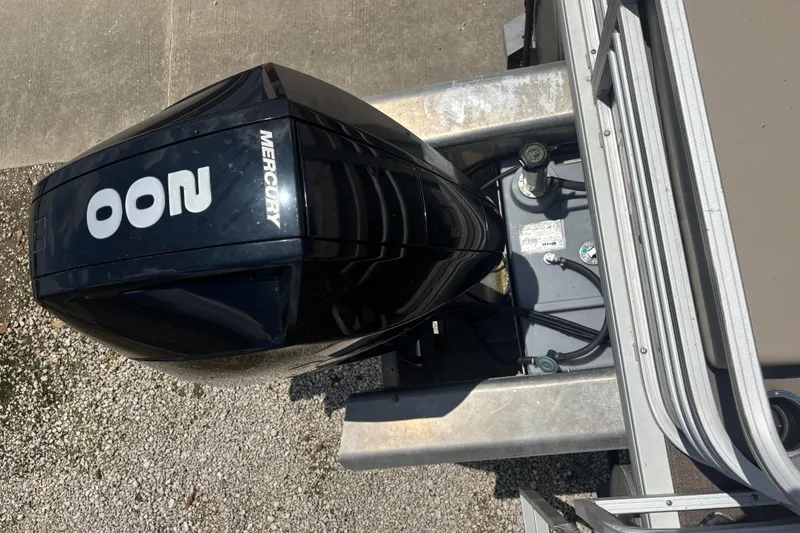 Slide: The Image of Top view of a 2020 Sun Tracker Fishin' Barge 22 XP3 with Mercury outboard motor. - 3