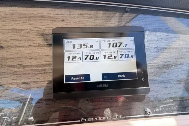 Slide: The Image of Yamaha display on 2024 Grady-White Freedom 335 showing fuel usage and trip data. - 9