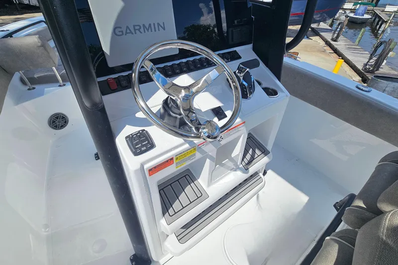 Slide: The Image of Steering console of 2027 Sea Hunt Ultra 245 SE boat with Garmin navigation system. - 18
