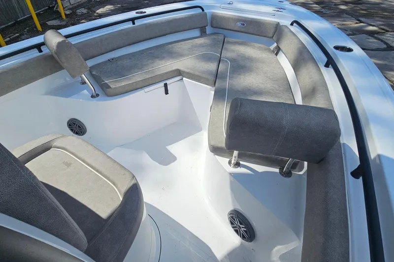 Slide: The Image of Interior of 2027 Sea Hunt Ultra 245 SE boat with gray seating and speakers. - 26