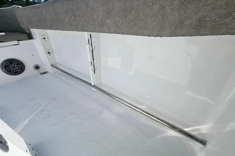 Slide: The Image of Interior view of 2027 Sea Hunt Ultra 245 SE boat, featuring sleek seating and speaker system. - 30
