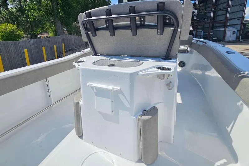 Slide: The Image of 2027 Sea Hunt Ultra 245 SE boat interior with seating and storage compartments. - 13
