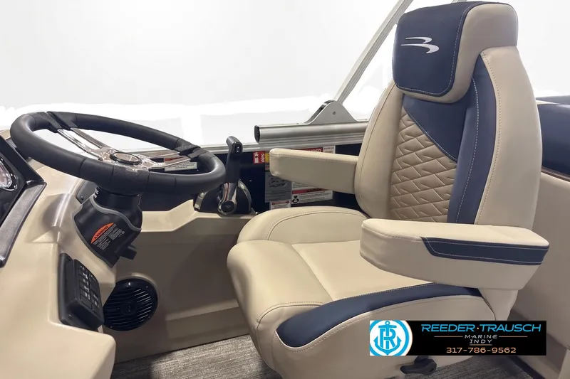 Slide: The Image of Captain's chair and steering wheel of 2027 Bennington 22 SSR boat interior. - 4