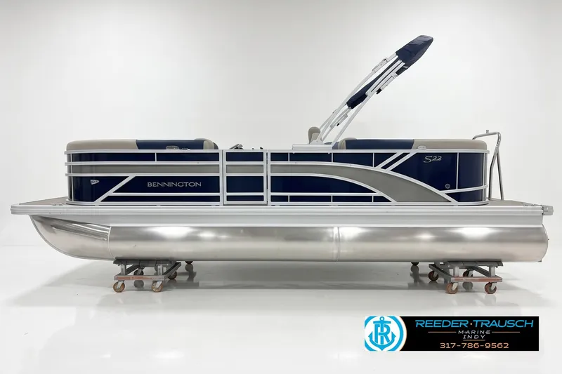 The Image of 2027 Bennington 22 SSR pontoon boat on display in a showroom. - 1