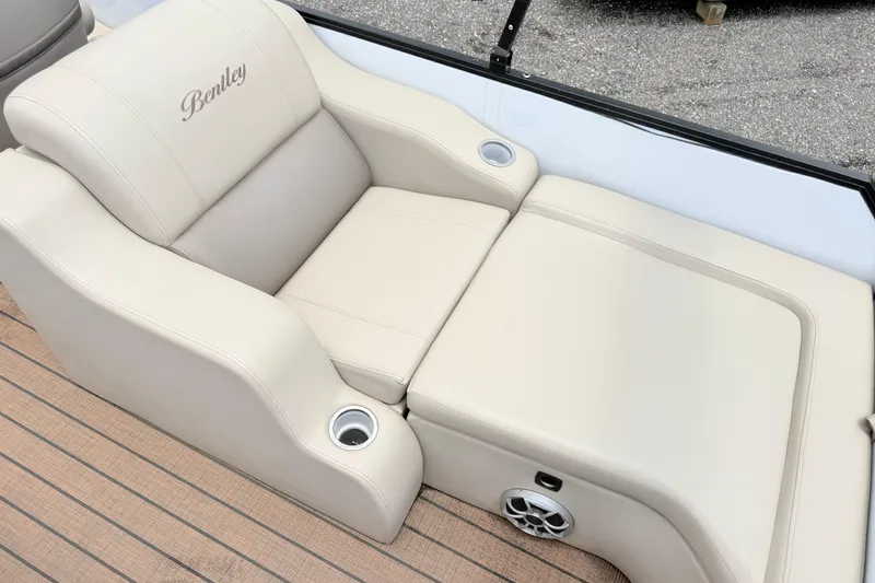 Slide: The Image of 2023 Bentley Pontoons 220 Elite Rear Lounger with beige upholstery and cup holders. - 17