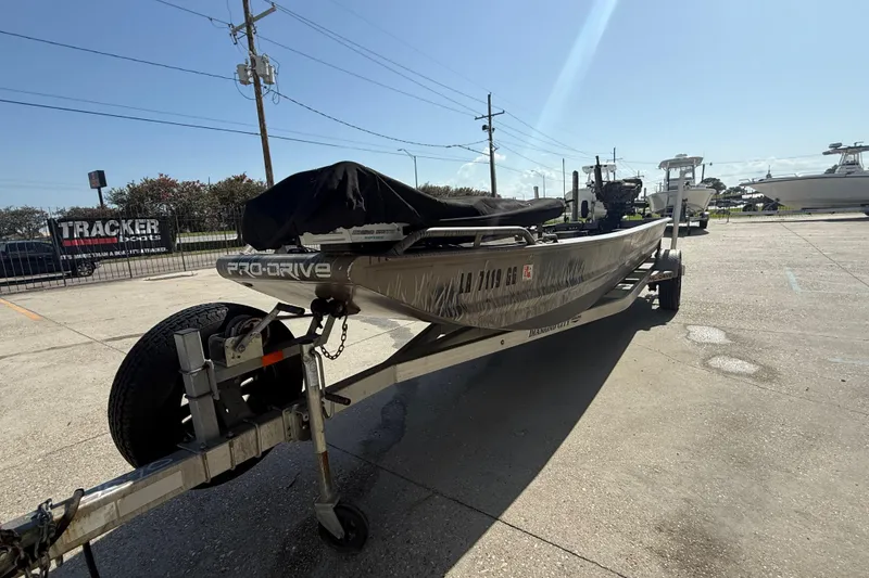 Slide: The Image of 2017 Pro-Drive 2048 boat on trailer in sunny outdoor setting. - 5