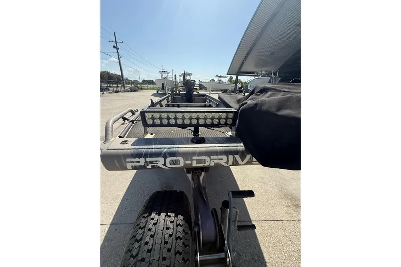 Slide: The Image of 2017 Pro-Drive 2048 boat trailer with light bar, parked outdoors. - 9