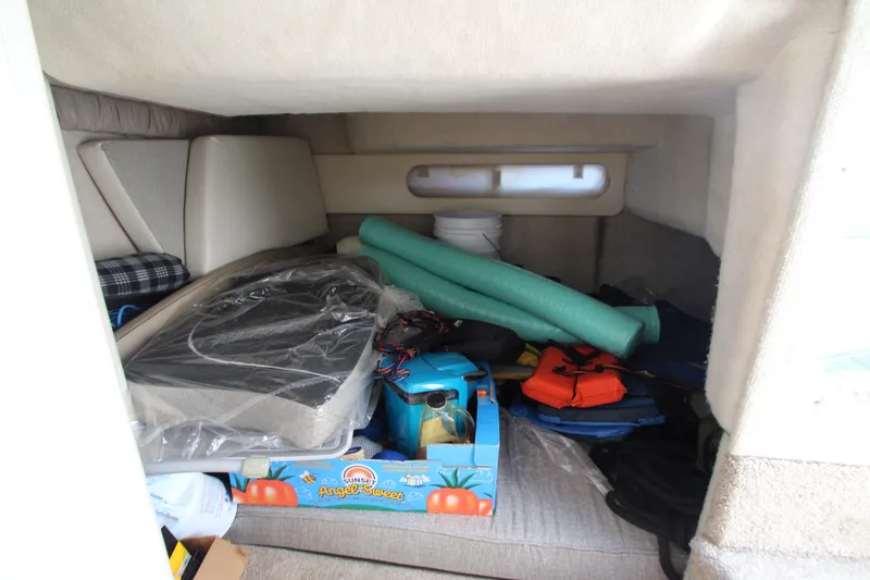 Slide: The Image of Interior cabin of 1999 Bayliner 3055 Ciera with stored items and equipment. - 20