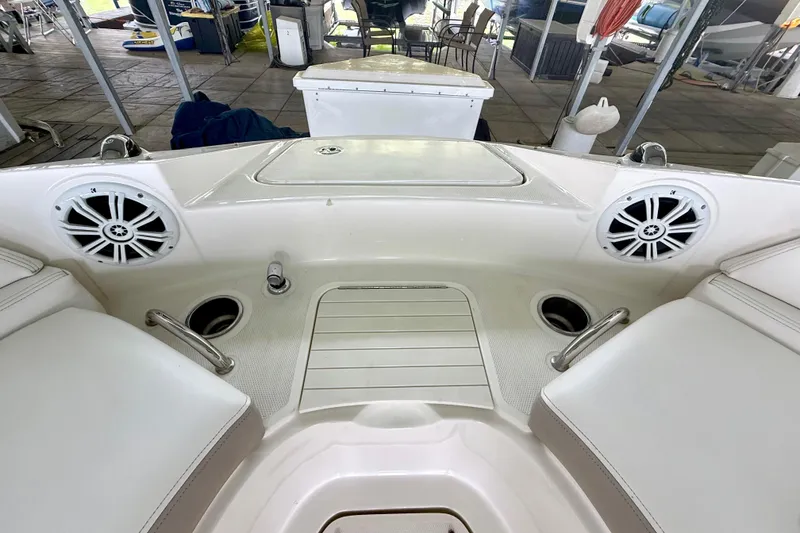 Slide: The Image of Interior view of a 2013 Sea Ray 260 Sundeck boat with speakers and seating. - 16