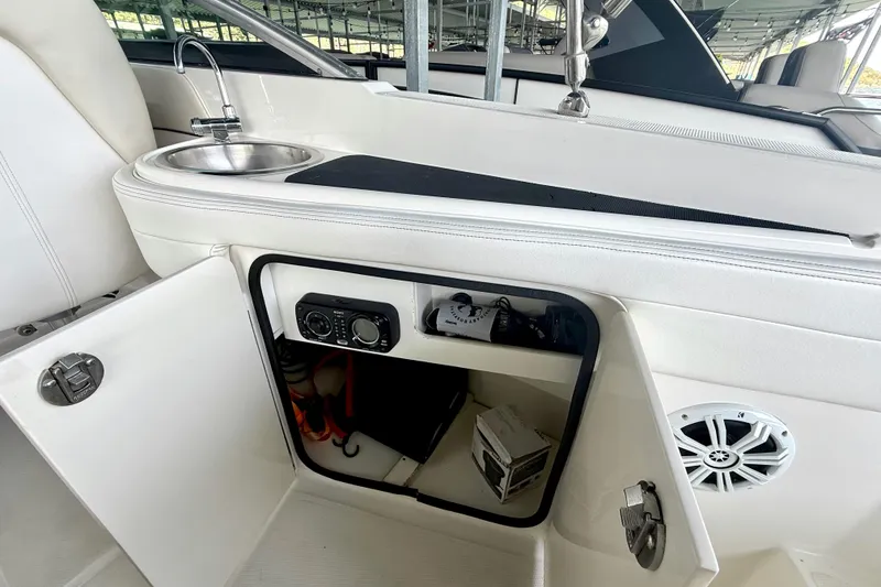 Slide: The Image of Interior view of a 2013 Sea Ray 260 Sundeck boat with sink and storage compartment. - 22