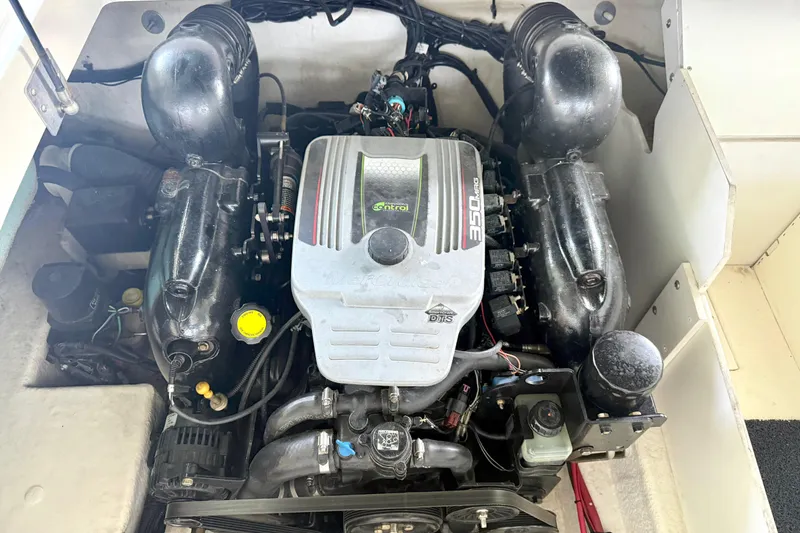 Slide: The Image of Engine of a 2013 Sea Ray 260 Sundeck boat, showcasing detailed components. - 27