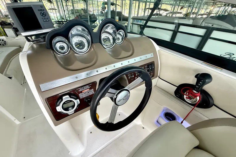 Slide: The Image of Cockpit of 2013 Sea Ray 260 Sundeck with steering wheel and gauges. - 20