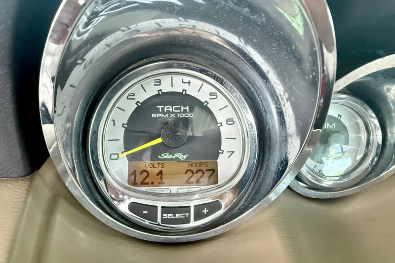 Slide: The Image of Close-up of 2013 Sea Ray 260 Sundeck tachometer displaying 12.1 volts and 227 hours. - 28