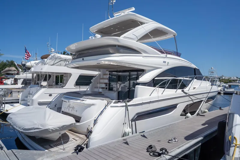 Slide: The Image of Luxurious 2021 Princess F55 yacht docked at marina under clear blue sky. - 34