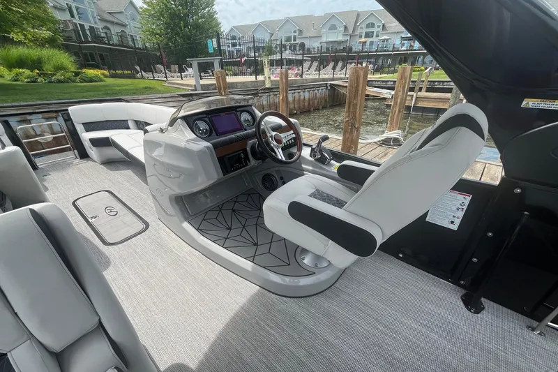 Slide: The Image of 2024 Harris Grand Mariner 250 boat interior with modern helm and luxurious seating. - 20