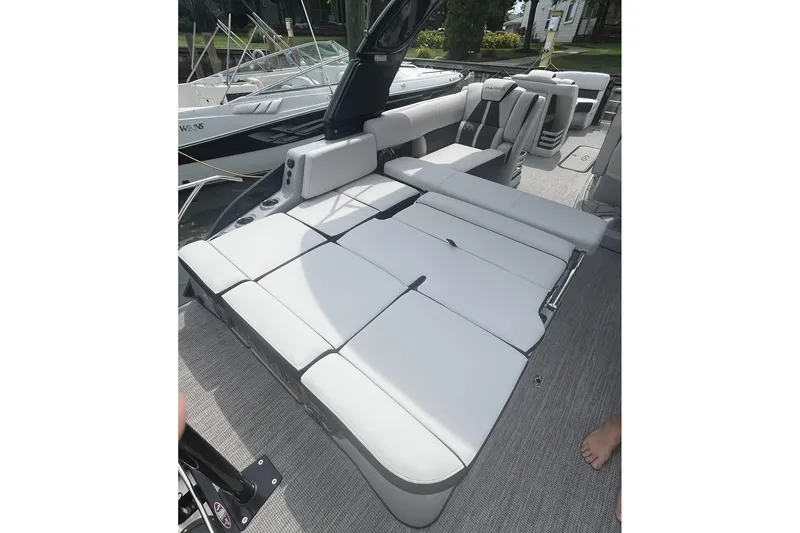 Slide: The Image of 2024 Harris Grand Mariner 250 boat interior with luxurious seating and modern design. - 24