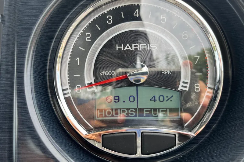 Slide: The Image of Close-up of 2024 Harris Grand Mariner 250 RPM gauge displaying 69 hours and 40% fuel. - 10