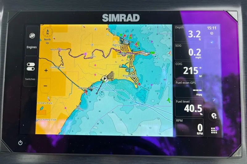 Slide: The Image of Simrad navigation display on 2024 Harris Grand Mariner 250 boat, showing map and data. - 8