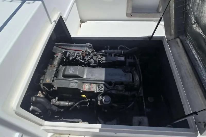 Slide: The Image of Engine compartment of a 2003 True World Marine 286 boat, showcasing detailed mechanical components. - 23