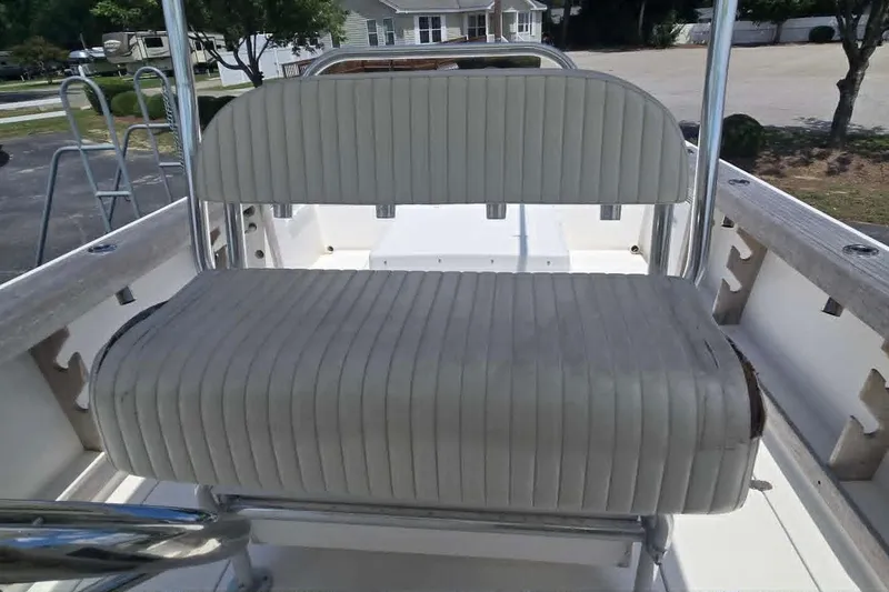 Slide: The Image of 2003 True World Marine 286 boat seat with striped upholstery and metal frame. - 14