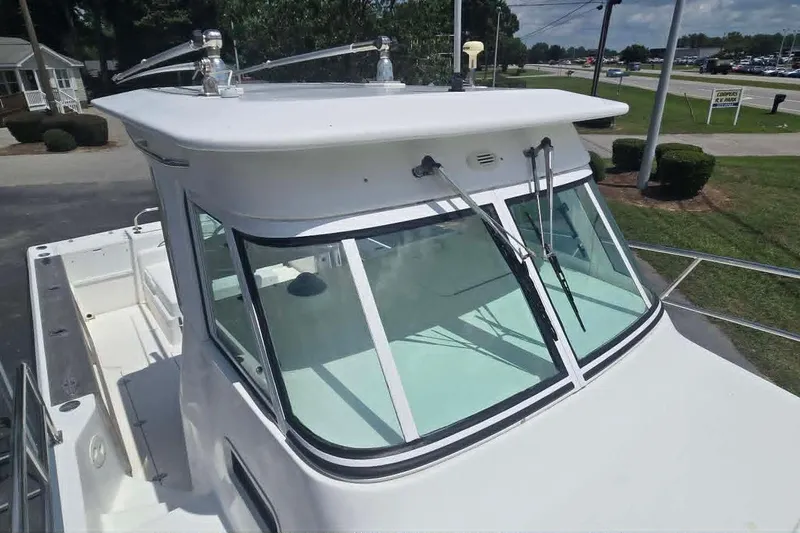 Slide: The Image of 2003 True World Marine 286 boat with sleek cabin design and windshield wipers. - 5