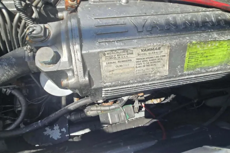 Slide: The Image of Yanmar engine in a 2003 True World Marine 286 boat, showcasing model and serial details. - 22