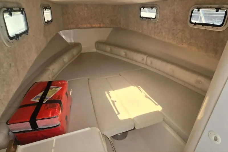 Slide: The Image of Interior cabin of 2003 True World Marine 286 boat with seating and windows. - 18
