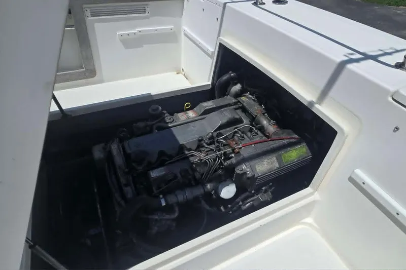 Slide: The Image of Engine compartment of a 2003 True World Marine 286 boat, showcasing the engine details. - 21
