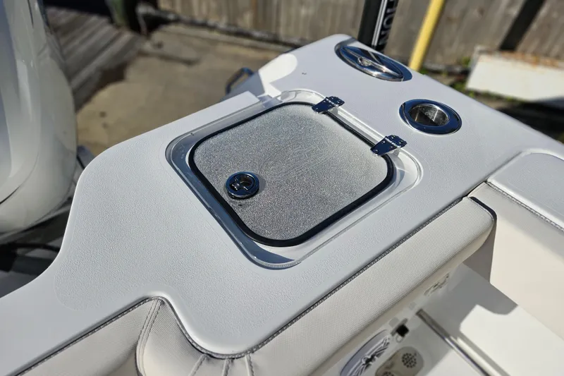 Slide: The Image of 2026 Sea Hunt Gamefish 30 Forward Seating boat detail, featuring a sleek storage compartment. - 15