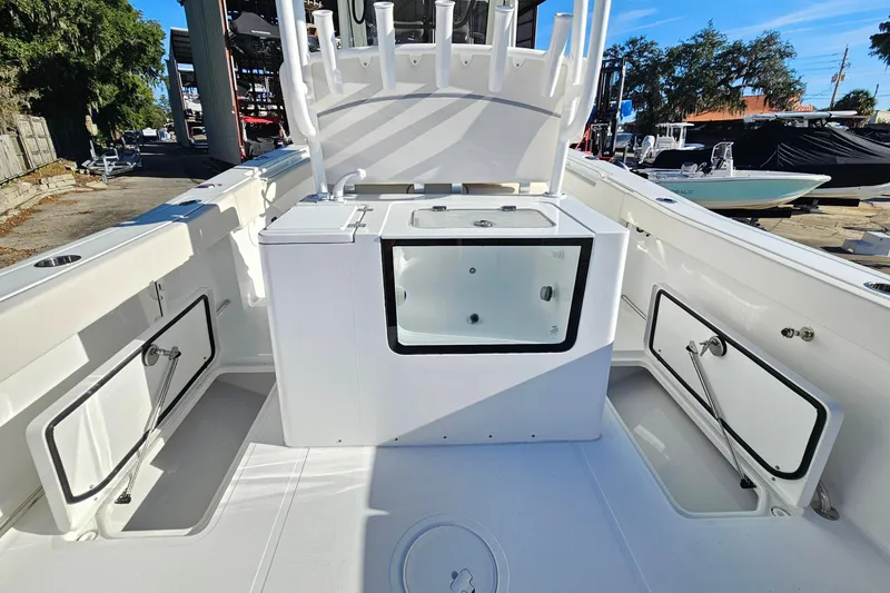 Slide: The Image of 2026 Sea Hunt Gamefish 30 Forward Seating boat interior with storage compartments. - 19