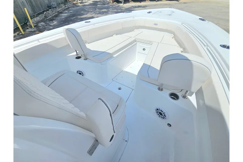 Slide: The Image of 2026 Sea Hunt Gamefish 30 Forward Seating, spacious white interior with comfortable seating. - 32
