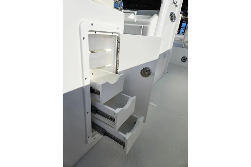 Slide: The Image of 2026 Sea Hunt Gamefish 30 Forward Seating storage drawers on deck. - 24