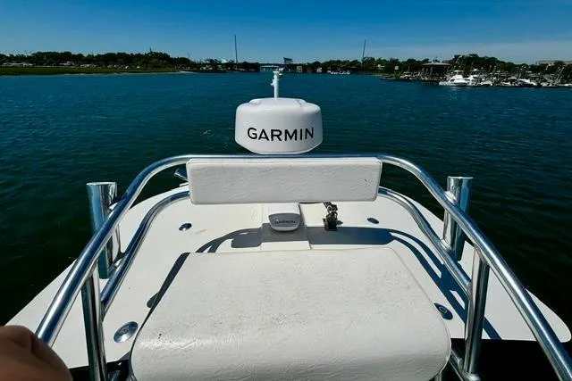 Slide: The Image of 2021 Tideline 235 boat with Garmin equipment on calm water, clear sky background. - 6