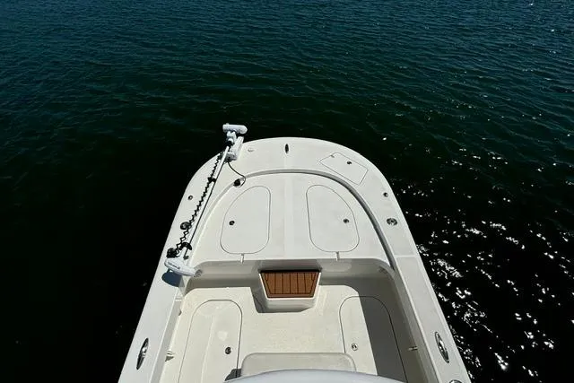 Slide: The Image of Bow view of 2021 Tideline 235 boat on calm water. - 4