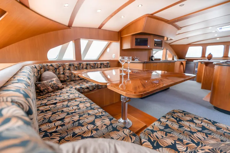 Slide: The Image of Luxurious interior of 2025 Shuttleworth 52 AeroRig yacht with elegant wood and floral upholstery. - 21