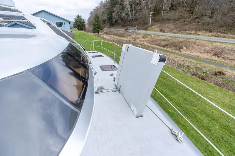 Slide: The Image of 2025 Shuttleworth 52 AeroRig yacht deck with sleek design and scenic background. - 15