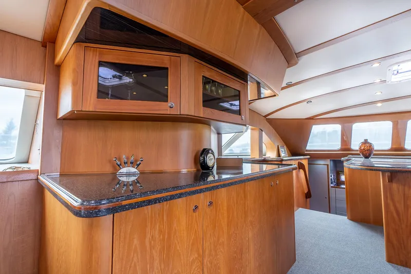 Slide: The Image of Luxurious interior of 2025 Shuttleworth 52 AeroRig yacht with elegant wood cabinetry. - 25