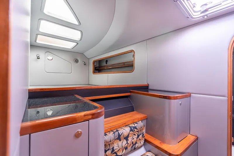 Slide: The Image of Interior of 2025 Shuttleworth 52 AeroRig yacht, featuring modern design and wood accents. - 33