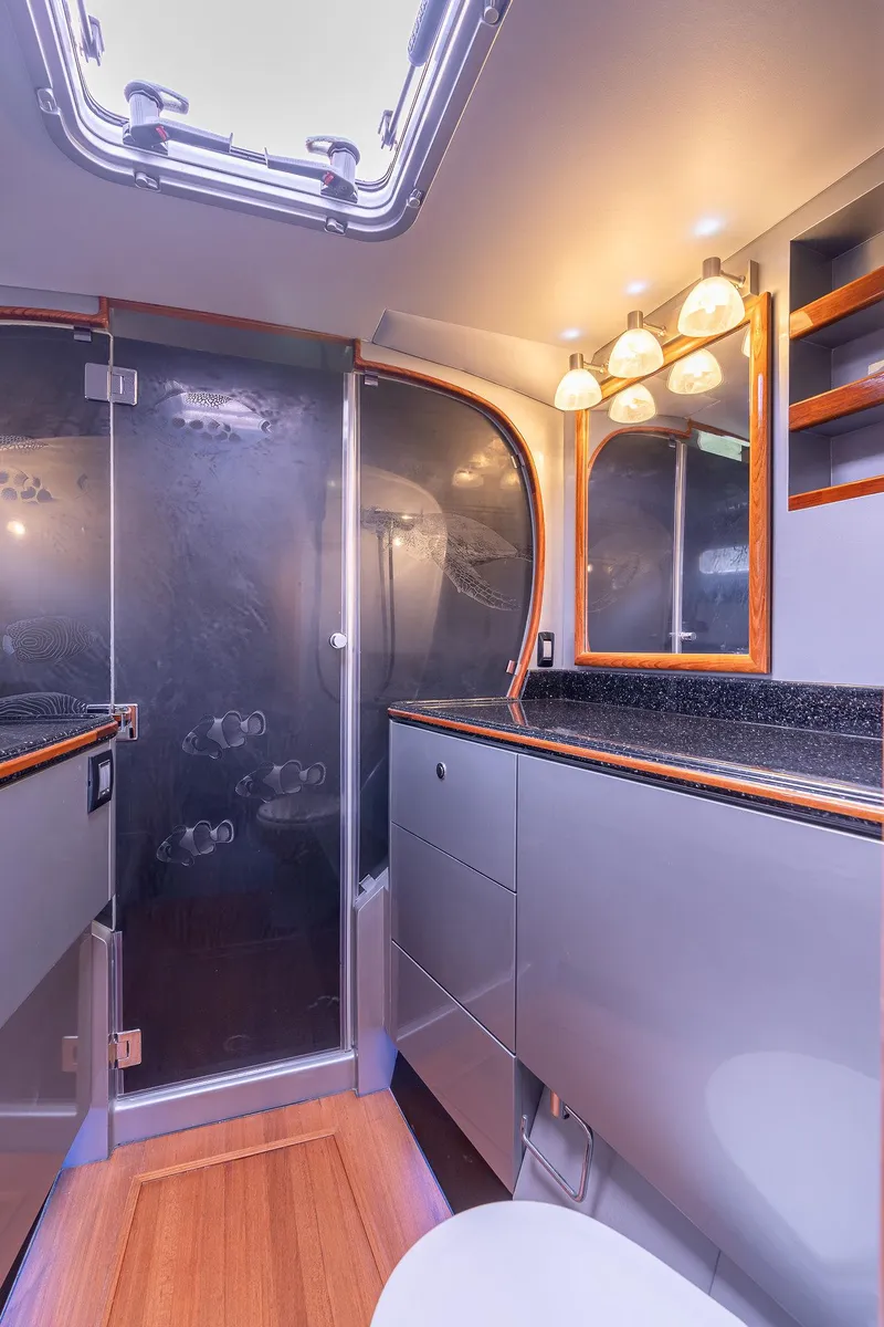 Slide: The Image of Luxurious bathroom interior of 2025 Shuttleworth 52 AeroRig yacht, featuring modern fixtures and elegant design. - 48