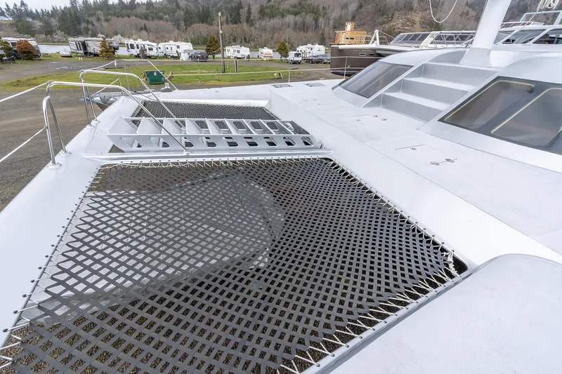 Slide: The Image of Deck view of 2025 Shuttleworth 52 AeroRig yacht with netting and sleek design. - 14