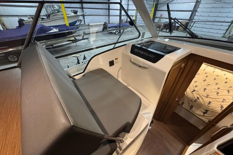 Slide: The Image of Interior view of 2024 Beneteau Antares 9 boat, showcasing helm and seating area. - 10