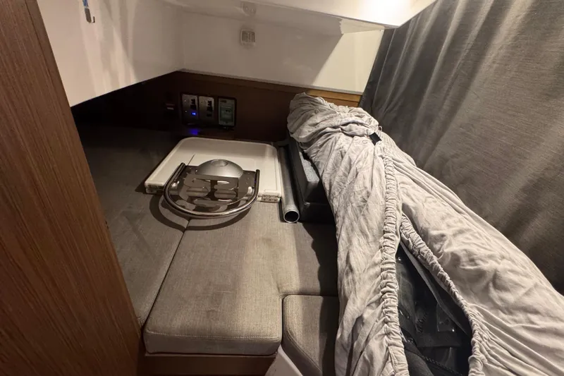 Slide: The Image of 2024 Beneteau Antares 9 cabin interior with seating and storage area. - 15