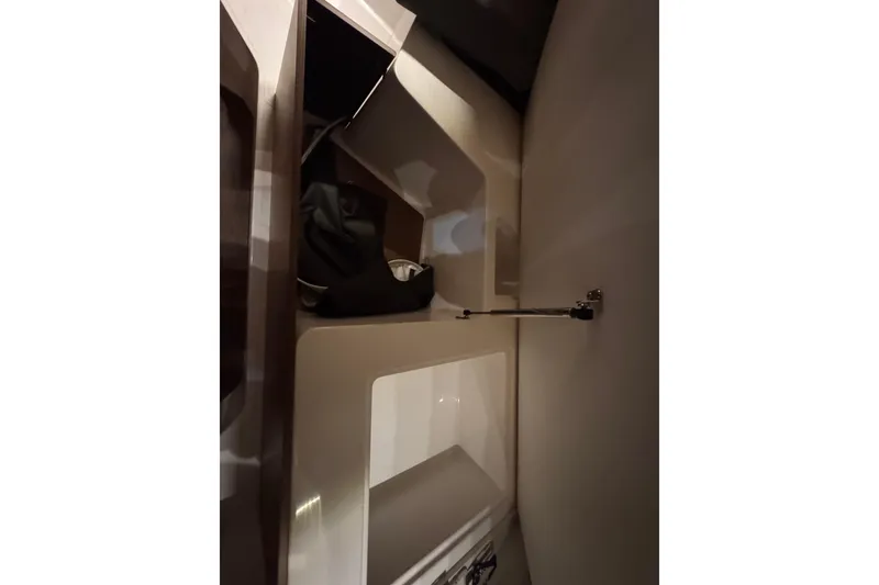 Slide: The Image of Interior storage compartment of 2024 Beneteau Antares 9 boat, showcasing sleek design. - 22