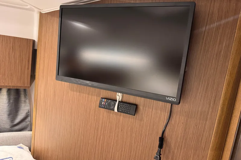 Slide: The Image of Vizio TV mounted on wood panel in 2024 Beneteau Antares 9 cabin. - 20
