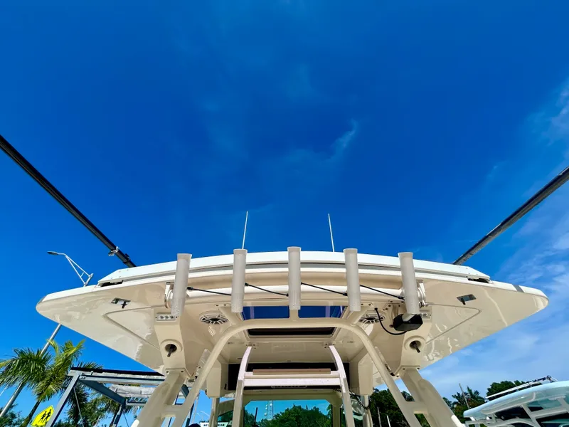 Slide: The Image of View of a Scout 380 boat's roof under a clear blue sky. - 24