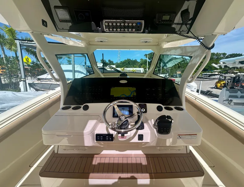 Slide: The Image of The cockpit of a 2021 Scout 380 with modern helm and electronics. - 2