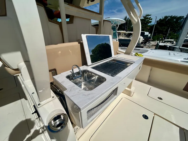 Slide: The Image of The 2021 Scout 380 features an outdoor kitchen with a sink and grill. - 7